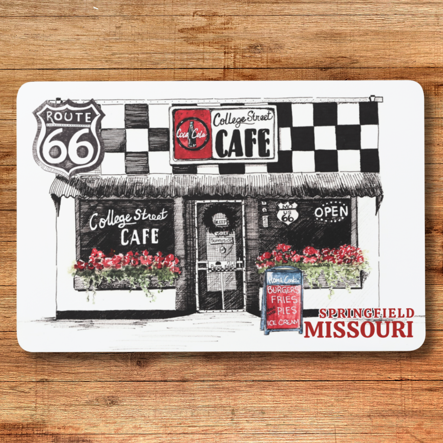 Placemat with illustration of College Street Cafe on a wooden surface
