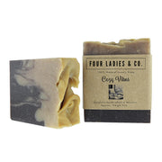 Two bars of soap with 'Four Ladies & Co.' packaging on a white background