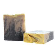 Two bars of soap with different color patterns on a white background