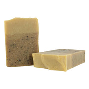 Two rectangular bars of soap on a white background