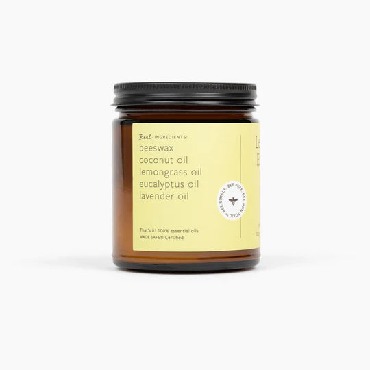 Jar of candle with label on a white background
