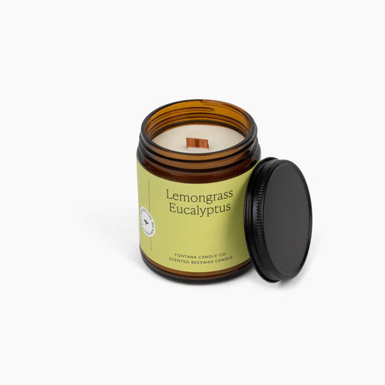 Lemongrass Eucalyptus candle in a brown jar with a black lid on a white background