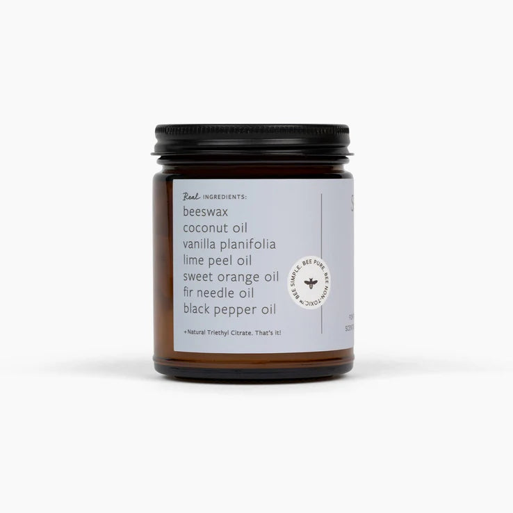 Candle jar with a label on a white background