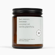 Candle jar with a label on a white background