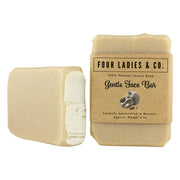 Two natural luxury soap bars with 'Four Ladies & Co.' packaging on a white background