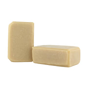 Two beige soap bars on a white background