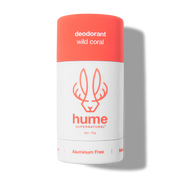 Deodorant stick with coral cap and white body on a white background
