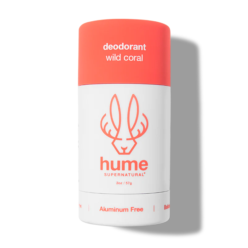 Deodorant stick with coral cap and white body on a white background