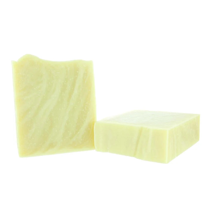Two pale yellow rectangular bars of soap standing upright on a plain white background.