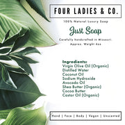 A clean product information card for Four Ladies & Co. Just Soap, featuring a white background with green tropical leaves on the left side and text detailing the ingredients and product features.