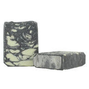 Two bars of soap with a black and white marbled pattern on a white background