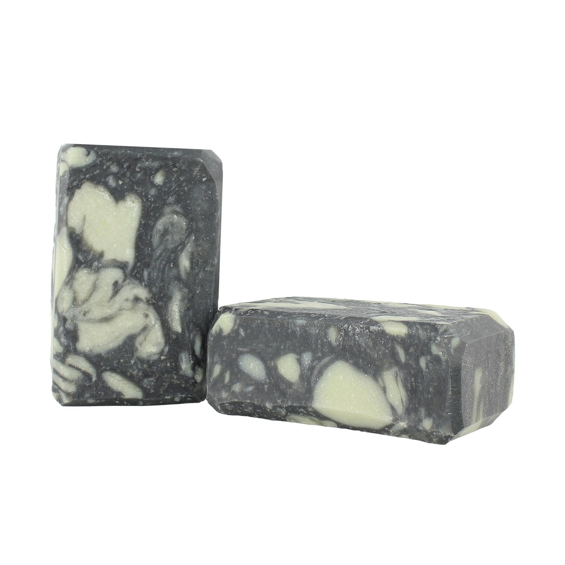 Two bars of black and white soap on a white background