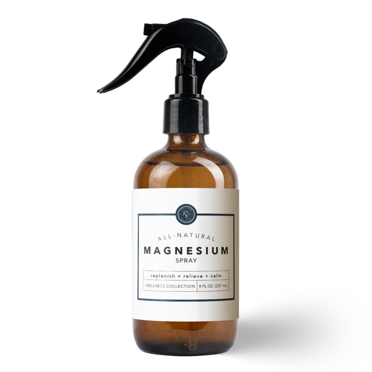 Brown spray bottle labeled 'All Natural Magnesium Spray' on a white background