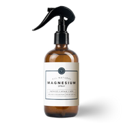 Brown spray bottle labeled 'All Natural Magnesium Spray' on a white background