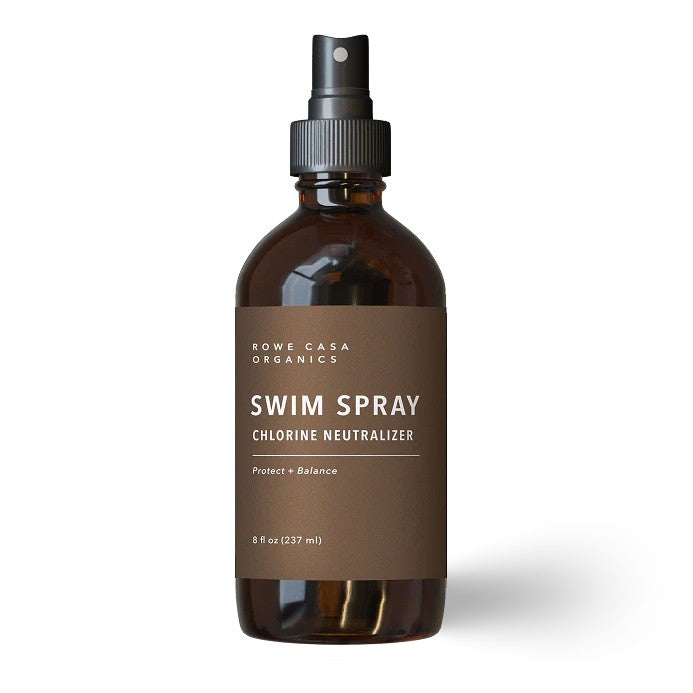 Brown spray bottle labeled 'Swim Spray' by Rowe Casa Organics on a white background