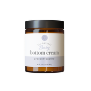 Rowe Casa Jar of baby bottom cream on a white background
