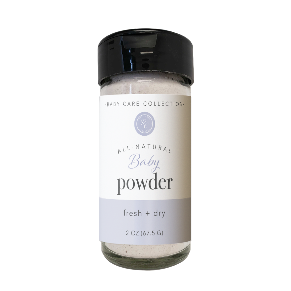 Rowe Casa Bottle of all-natural baby powder with a black cap on a white background