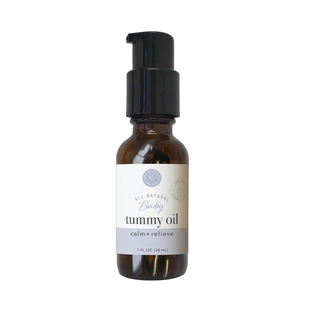 Rowe Casa Bottle of baby tummy oil with a black pump on a white background