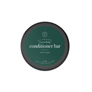 Rowe Casa Round container of all-natural nourishing conditioner bar on a white background