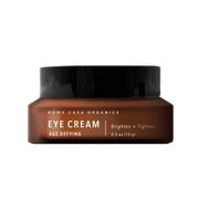 Brown jar of Rowe Casa eye cream with black lid on a white background