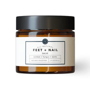Jar of all-natural feet and nail salve on a white background