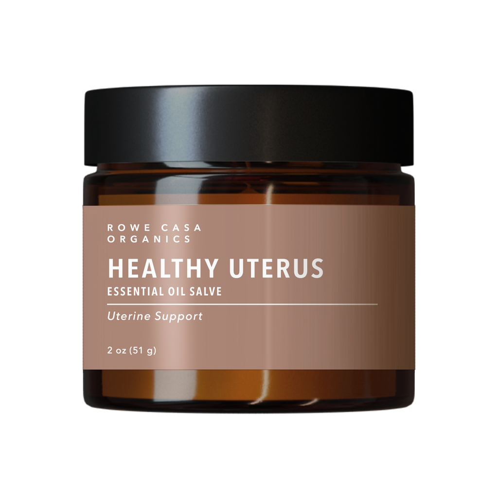 Jar of Rowe Casa Organics Healthy Uterus Essential Oil Salve on a white background
