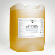 Large container of Castile soap with a label on a white background