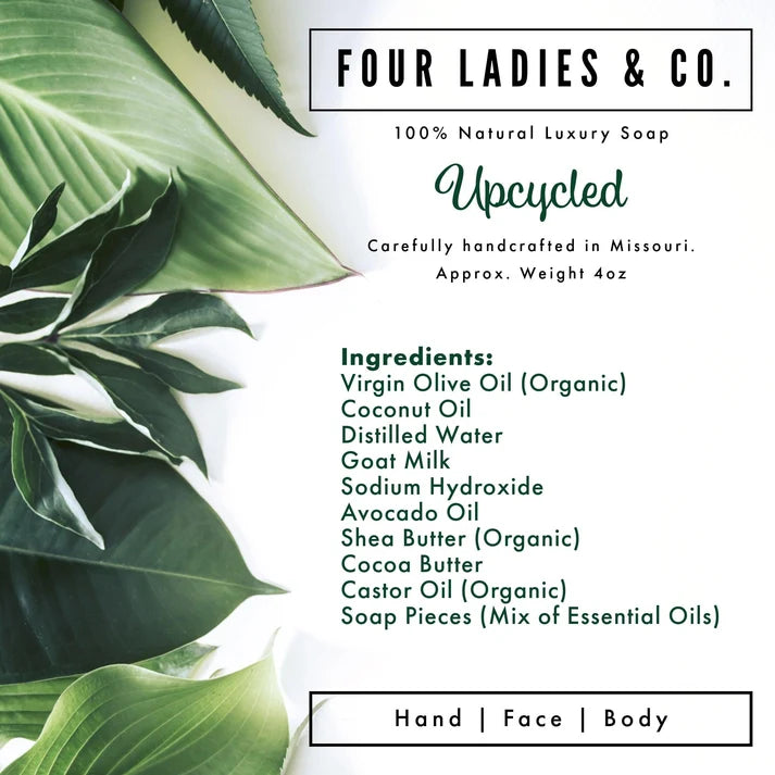 A square product label for Four Ladies & Co. Upcycled soap, featuring a white background with green tropical leaves on the left side and black and green text detailing the ingredients and product type.