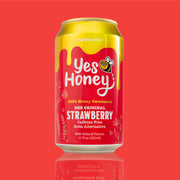 Yes Honey strawberry soda can on a red background