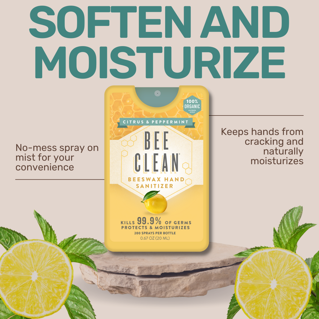 Bee Clean beeswax hand sanitizer packaging with lemon slices and mint leaves on a light background.