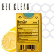 Bee Clean product packaging with lemon slice on a honeycomb background