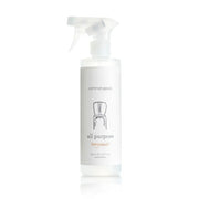 A white plastic spray bottle of Common Good All Purpose Bergamot cleaning solution on a white background with a soft reflection.