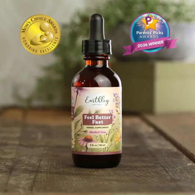 Bottle of Earthley Feel Better Fast supplement with awards on a wooden surface