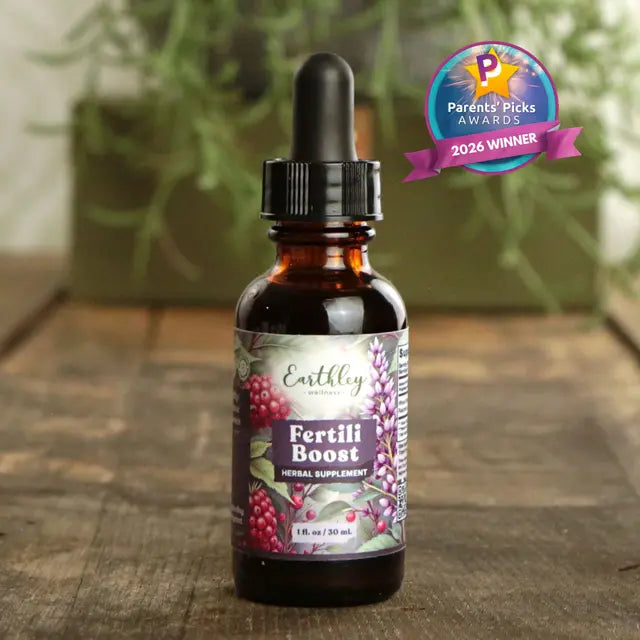Bottle of Earthley Fertili Boost supplement with a 'Parents' Picks Awards 2026 Winner' badge on a wooden surface.