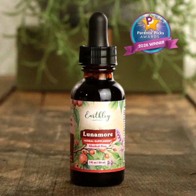 Bottle of Earthley Lunamore supplement with a 'Parents' Picks Awards 2026 Winner' badge on a wooden surface.