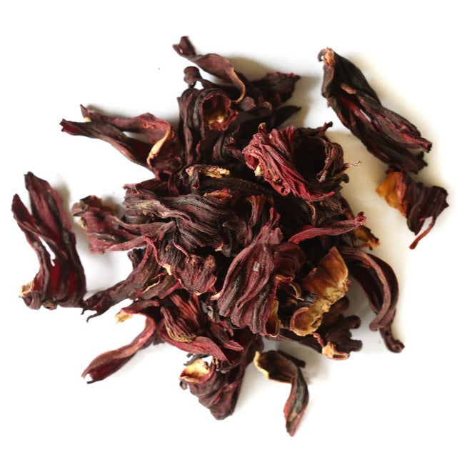 Dried hibiscus flowers on a white background
