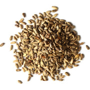 Pile of milk thistle seeds on a white background