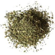 Mixture of dried nettle herbs on a white background