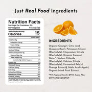 Nutrition facts label with ingredients list for a product containing organic oranges on a light gray background.