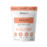 Pouch of peach electrolytes with 'Just Ingredients' branding on a white background