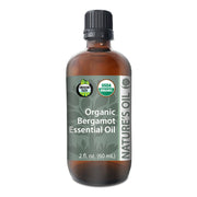 Bottle of Organic Bergamot Essential Oil with label on a white background