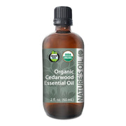 Bottle of Organic Cedarwood Essential Oil with label on a white background