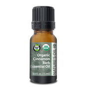 Bottle of Organic Cinnamon Bark Essential Oil with a green label on a white background