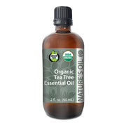 Bottle of Organic Tea Tree Essential Oil with label on a white background