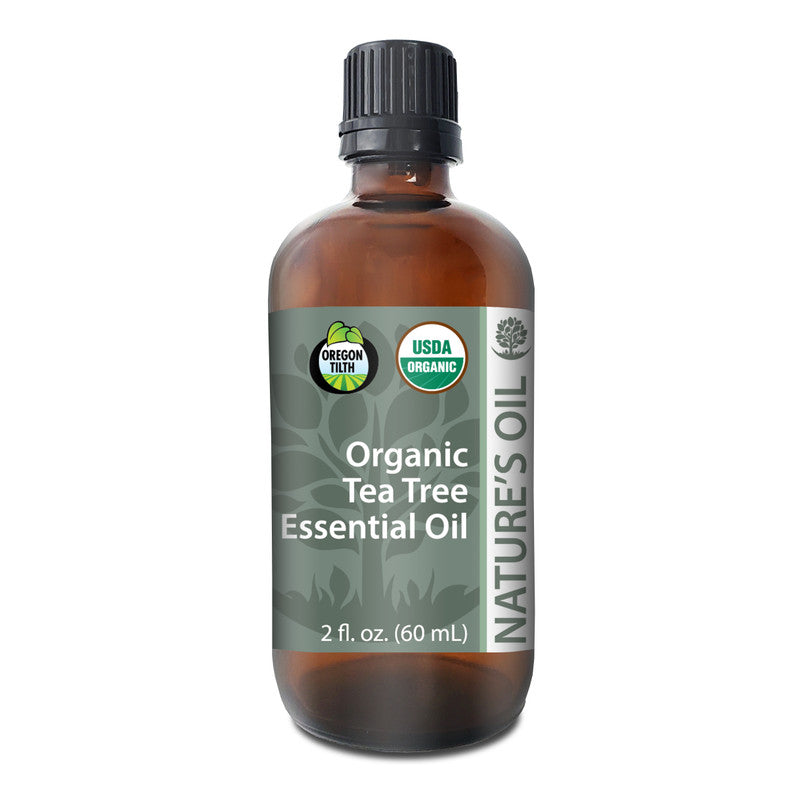 Bottle of Organic Tea Tree Essential Oil with label on a white background