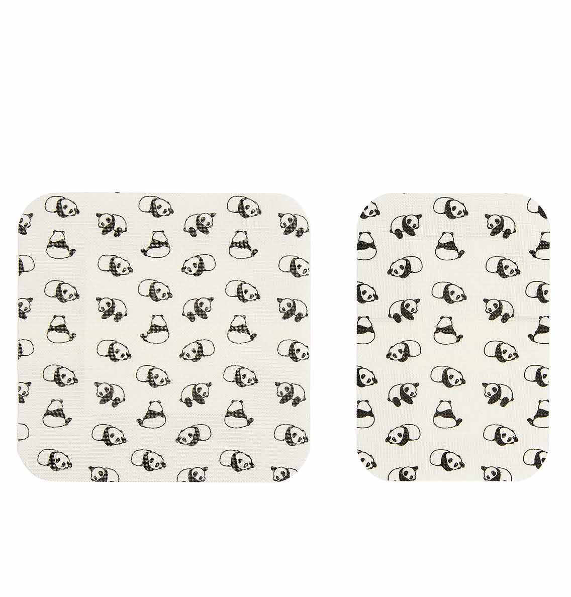 Two cream-colored mats with black panda pattern on a white background