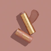 Two makeup products with 'Poppy & Pout' branding on a pink background