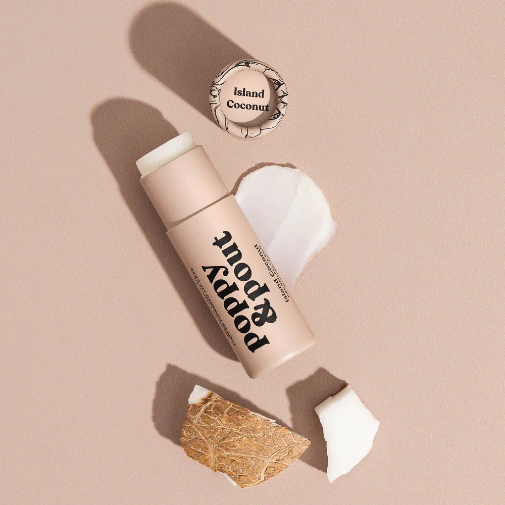 Lip balm with a coconut shell and 'Island Coconut' text on a beige background