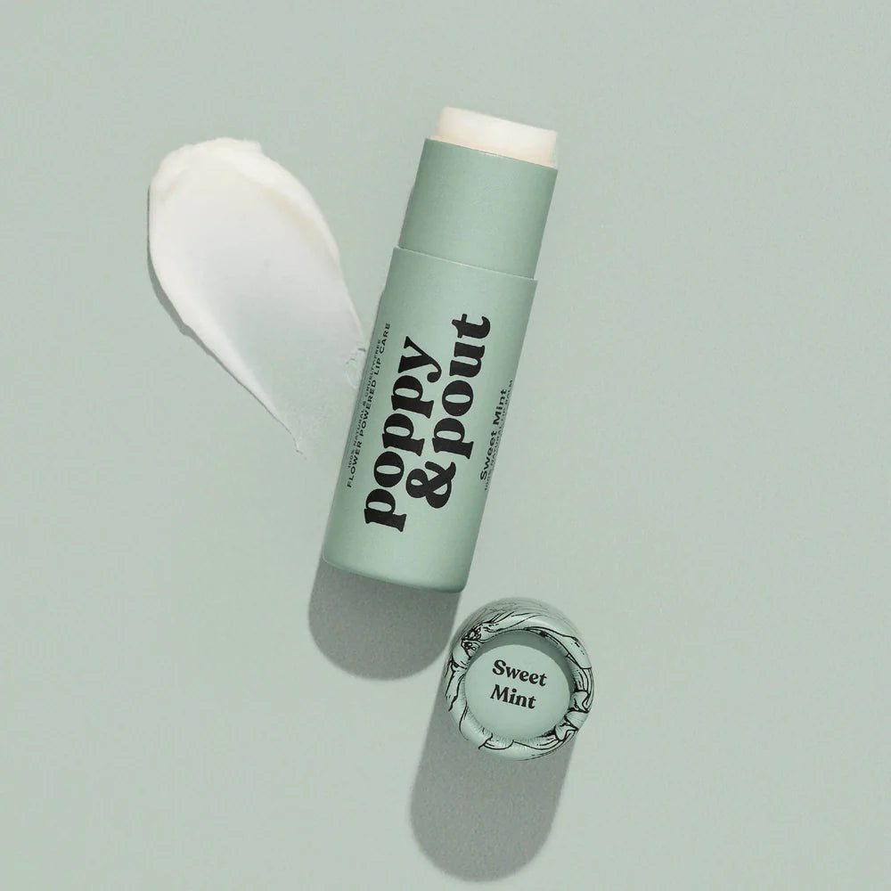 Mint green lip balm with 'Poppy & Pout' branding on a light gray background