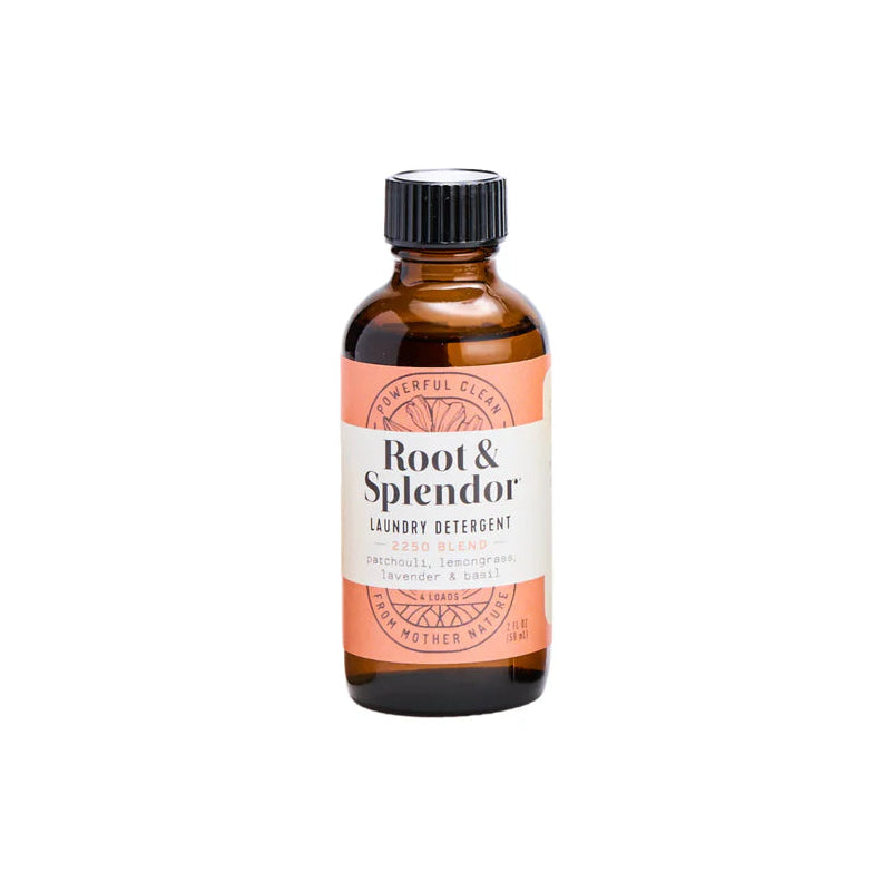 Bottle of 'Root & Splendor' laundry detergent on a white background